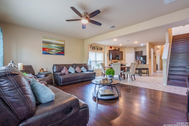 11607 Pelican Pass, San Antonio, TX 78221 - living room featuring a ceiling fan, light wood finished floors, stairway, and recessed lighting