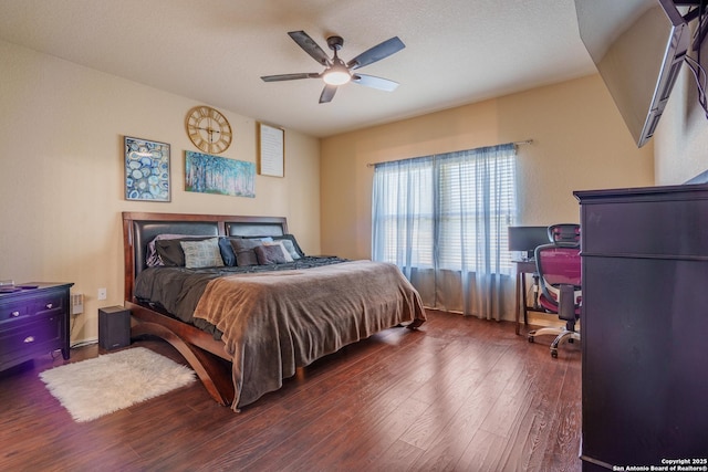11607 Pelican Pass, San Antonio, TX 78221 - bedroom with wood finished floors, an office area, and a ceiling fan