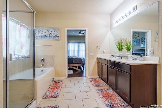 11607 Pelican Pass, San Antonio, TX 78221 - ensuite bathroom featuring double vanity, tile patterned flooring, a shower with door, a bath, and a ceiling fan