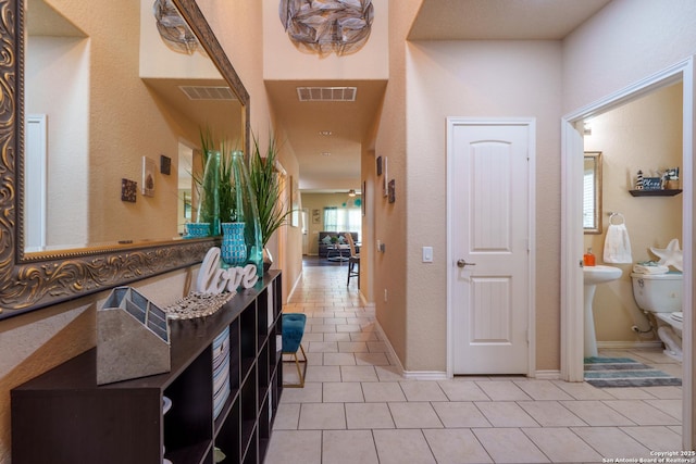 11607 Pelican Pass, San Antonio, TX 78221 - hall with light tile patterned floors and baseboards