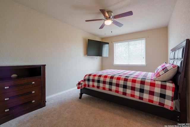11607 Pelican Pass, San Antonio, TX 78221 - bedroom with carpet flooring, baseboards, and ceiling fan