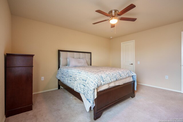 11607 Pelican Pass, San Antonio, TX 78221 - bedroom with light carpet, baseboards, and ceiling fan