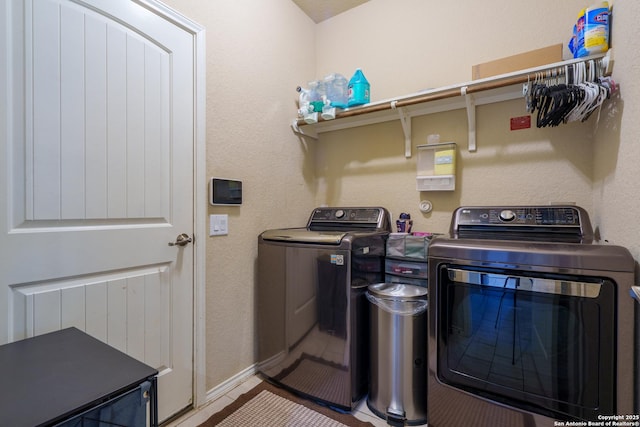 11607 Pelican Pass, San Antonio, TX 78221 - laundry room with independent washer and dryer and baseboards