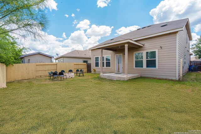 11607 Pelican Pass, San Antonio, TX 78221 - back of property with central AC unit, a patio area, and a fire pit
