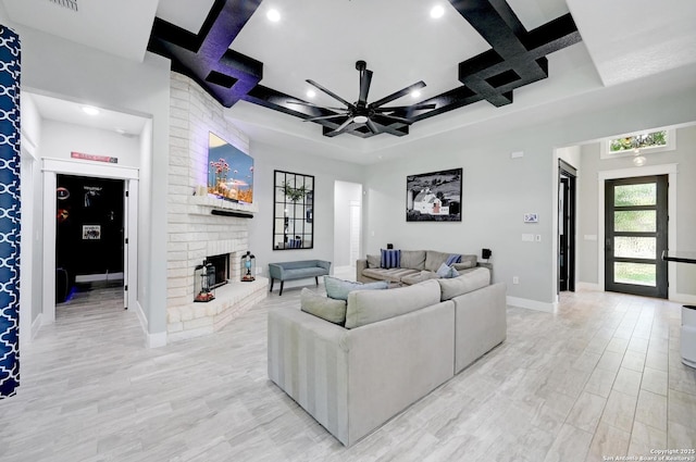 149 Chisum Ln, Vernia, TX 78121 - living room with coffered ceiling, ceiling fan, baseboards, light wood finished floors, and a brick fireplace