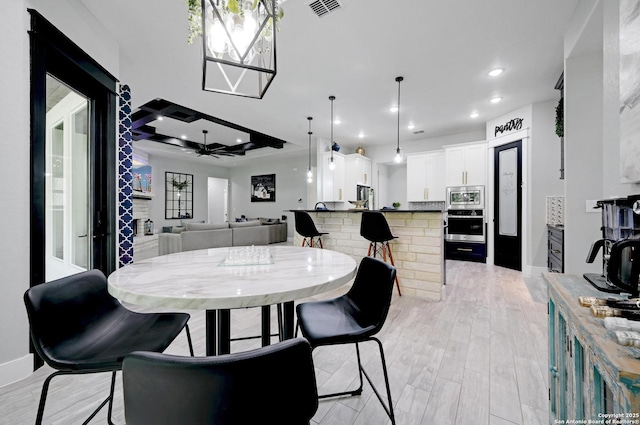 149 Chisum Ln, Vernia, TX 78121 - dining room featuring light wood-type flooring, recessed lighting, ceiling fan, and baseboards