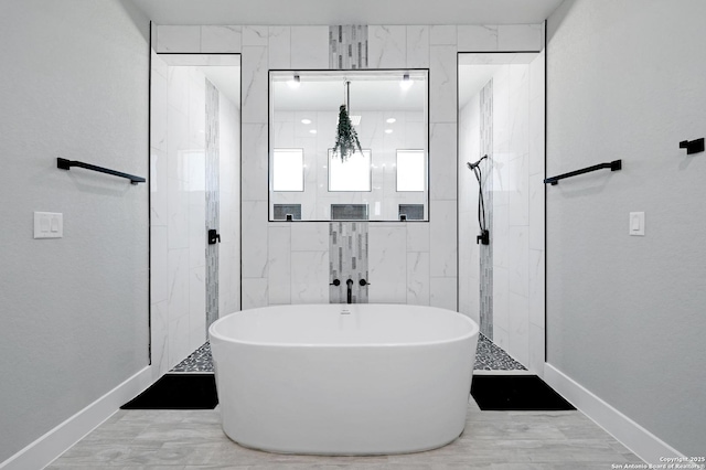 149 Chisum Ln, Vernia, TX 78121 - bathroom with a freestanding tub, a walk in shower, and baseboards