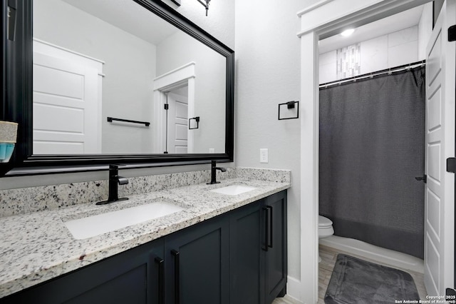 149 Chisum Ln, Vernia, TX 78121 - bathroom with toilet, double vanity, and a shower with curtain