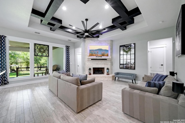 149 Chisum Ln, Vernia, TX 78121 - living room featuring coffered ceiling, ceiling fan, a brick fireplace, light wood-style flooring, and recessed lighting