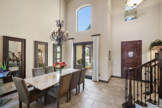 393 Upland Ct, Canyon Lake, TX 78133 - dining room with stairs, a towering ceiling, a chandelier, baseboards, and french doors