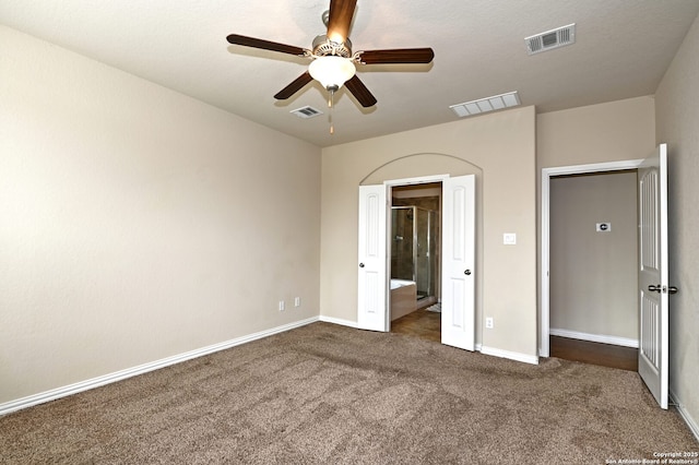 14402 Palomino Pl, San Antonio, TX 78254 - unfurnished bedroom featuring carpet floors, baseboards, a ceiling fan, and connected bathroom