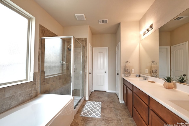 14402 Palomino Pl, San Antonio, TX 78254 - full bath with a stall shower, a bath, double vanity, and baseboards