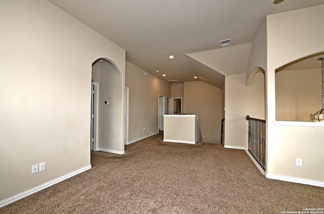 14402 Palomino Pl, San Antonio, TX 78254 - carpeted spare room with baseboards, vaulted ceiling, arched walkways, and recessed lighting