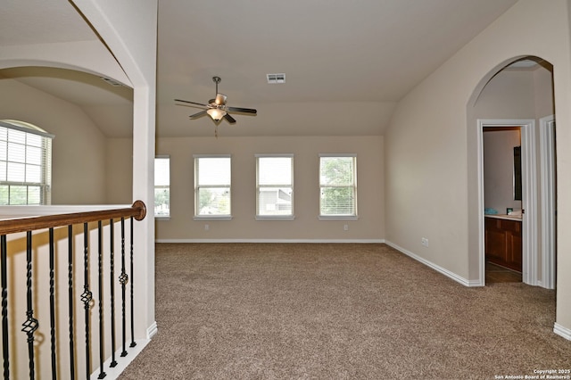14402 Palomino Pl, San Antonio, TX 78254 - unfurnished room featuring lofted ceiling, a ceiling fan, carpet floors, arched walkways, and baseboards