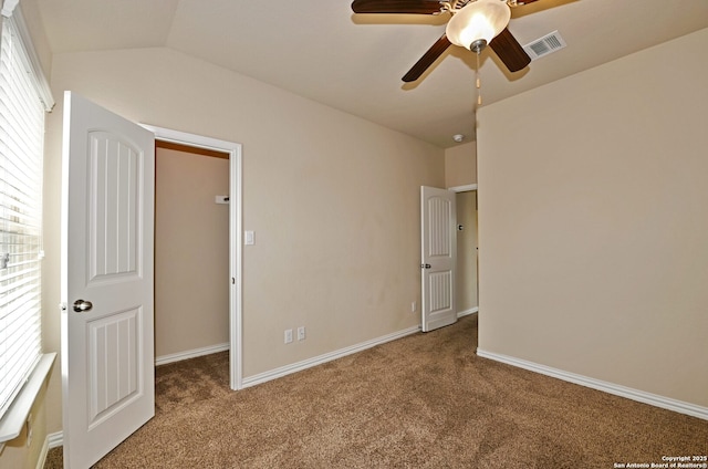 14402 Palomino Pl, San Antonio, TX 78254 - unfurnished bedroom with carpet, a walk in closet, baseboards, and ceiling fan