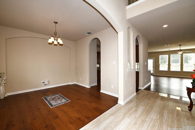 14402 Palomino Pl, San Antonio, TX 78254 - spare room with arched walkways, wood finished floors, and ceiling fan