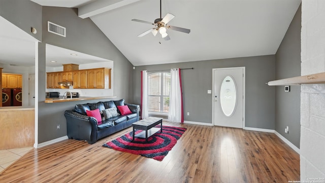 1070 Northpark, New Braunfels, TX 78130 - living area featuring ceiling fan, beam ceiling, wood finished floors, high vaulted ceiling, and baseboards