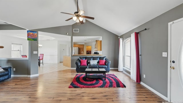 1070 Northpark, New Braunfels, TX 78130 - living room with a ceiling fan, light wood finished floors, high vaulted ceiling, and baseboards