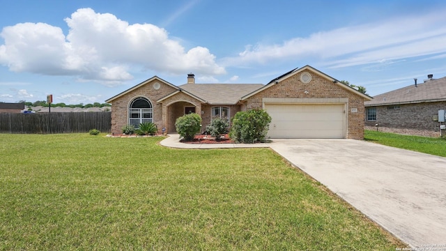 1070 Northpark, New Braunfels, TX 78130 - ranch-style home with brick siding, a garage, driveway, and a chimney