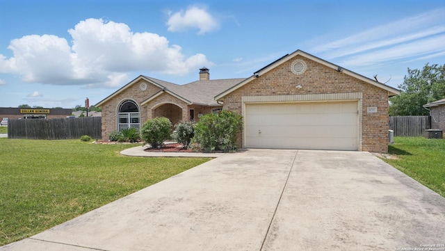 1070 Northpark, New Braunfels, TX 78130 - ranch-style home featuring brick siding, an attached garage, concrete driveway, and a chimney
