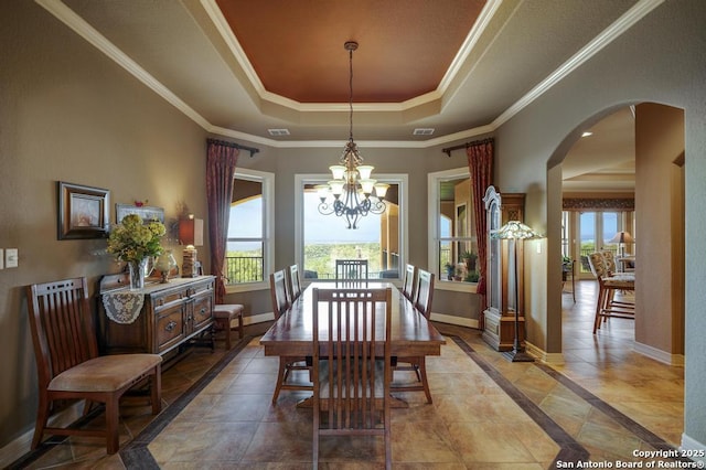 286 Settlers, Comfort, TX 78013 - dining space with a raised ceiling, arched walkways, baseboards, a chandelier, and crown molding