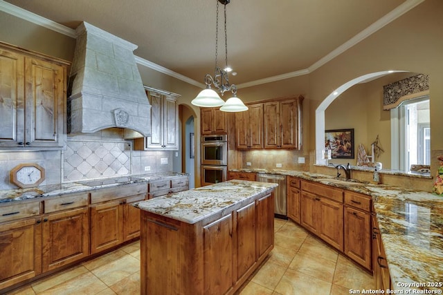 286 Settlers, Comfort, TX 78013 - kitchen featuring stainless steel appliances, arched walkways, a sink, custom range hood, and tasteful backsplash