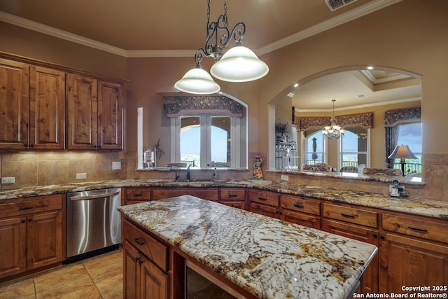 286 Settlers, Comfort, TX 78013 - kitchen featuring stainless steel dishwasher, arched walkways, ornamental molding, plenty of natural light, and light stone counters