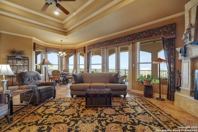 286 Settlers, Comfort, TX 78013 - living room with a chandelier, ornamental molding, a ceiling fan, and a tray ceiling