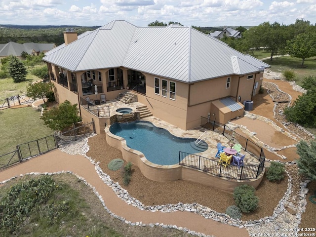 286 Settlers, Comfort, TX 78013 - view of swimming pool featuring a fenced backyard, a patio, and a pool with connected hot tub