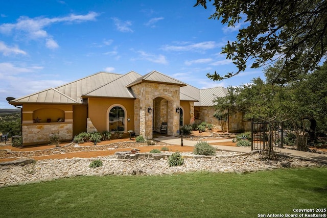 286 Settlers, Comfort, TX 78013 - view of front of house featuring a standing seam roof, stone siding, metal roof, and a front yard