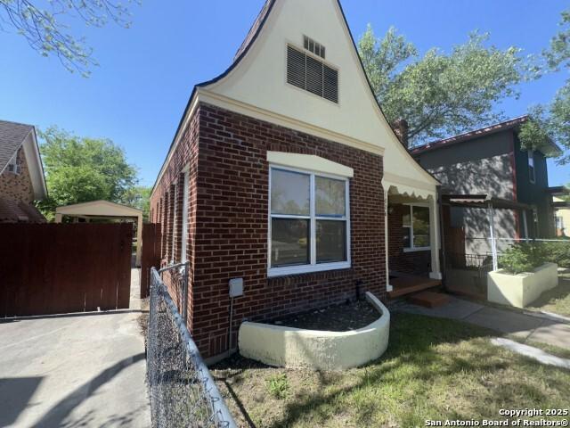 1806 W Magnolia, San Antonio, TX 78201 - view of side of property with brick siding and stucco siding