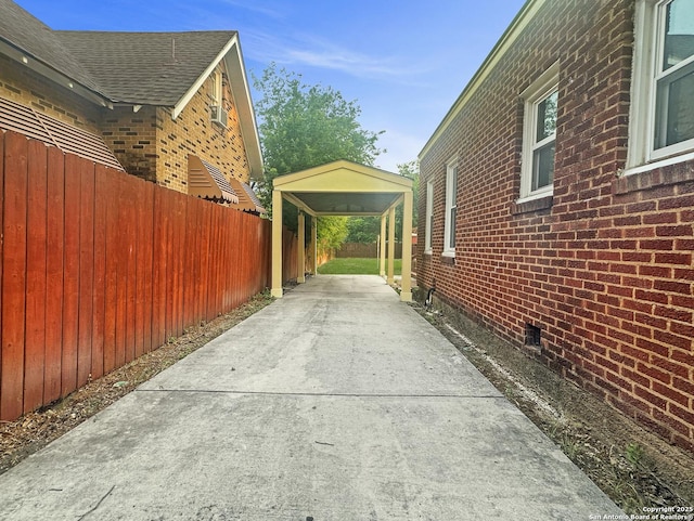 1806 W Magnolia, San Antonio, TX 78201 - view of property exterior featuring brick siding, fence, and a detached carport
