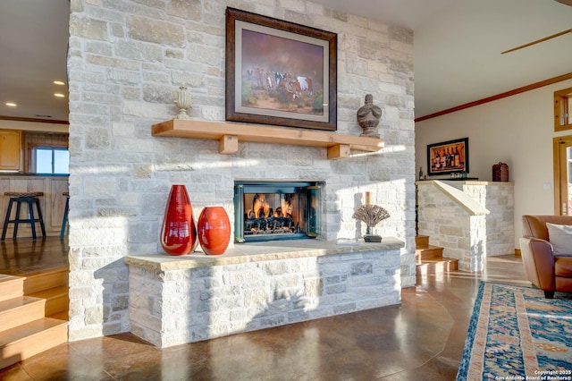 24005 Pedernales Canyon Trl, Spicewood, TX 78669 - living area featuring crown molding, concrete flooring, a fireplace, recessed lighting, and stairs