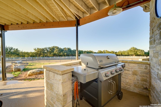 24005 Pedernales Canyon Trl, Spicewood, TX 78669 - view of patio with exterior kitchen and fence