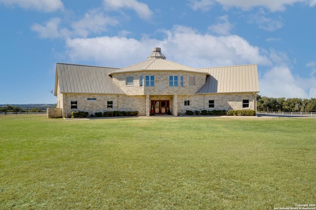 24005 Pedernales Canyon Trl, Spicewood, TX 78669 - view of front of home with stone siding, metal roof, french doors, and a standing seam roof