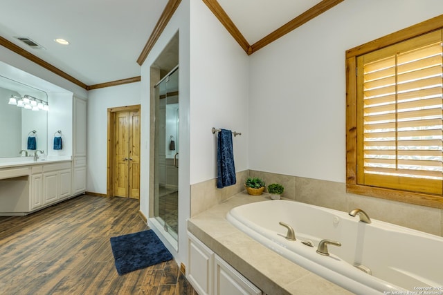 24005 Pedernales Canyon Trl, Spicewood, TX 78669 - full bath with crown molding, a stall shower, a garden tub, wood finished floors, and vanity