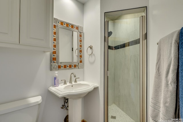 24005 Pedernales Canyon Trl, Spicewood, TX 78669 - full bathroom with toilet and a shower stall