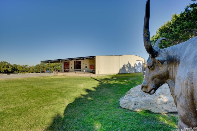 24005 Pedernales Canyon Trl, Spicewood, TX 78669 - back of house with an outbuilding, an exterior structure, and a pole building