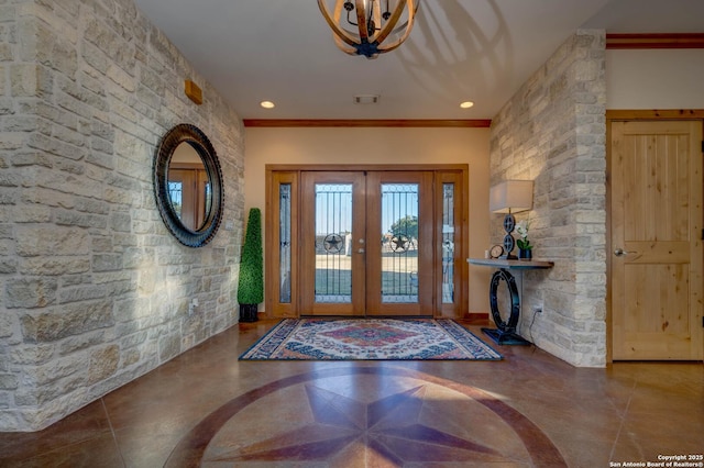 24005 Pedernales Canyon Trl, Spicewood, TX 78669 - foyer with a chandelier, french doors, and crown molding