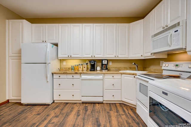 24005 Pedernales Canyon Trl, Spicewood, TX 78669 - kitchen featuring white appliances, a sink, dark wood-type flooring, light countertops, and white cabinetry