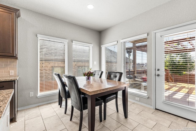 2126 Elysian, San Antonio, TX 78253 - dining space featuring a textured wall, light tile patterned floors, and baseboards