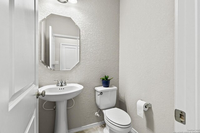 2126 Elysian, San Antonio, TX 78253 - bathroom featuring a textured wall and toilet