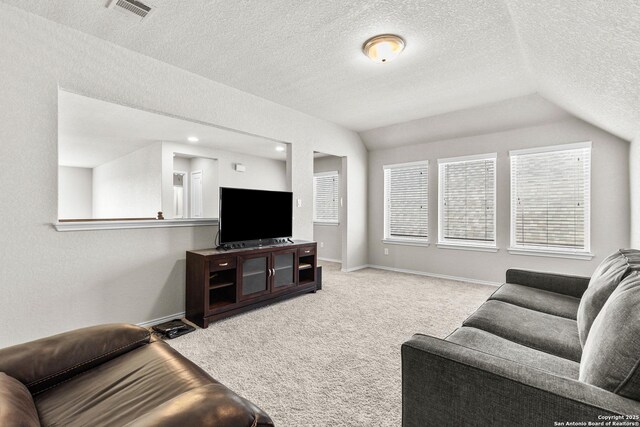 2126 Elysian, San Antonio, TX 78253 - carpeted living area with lofted ceiling, a textured ceiling, healthy amount of natural light, and baseboards