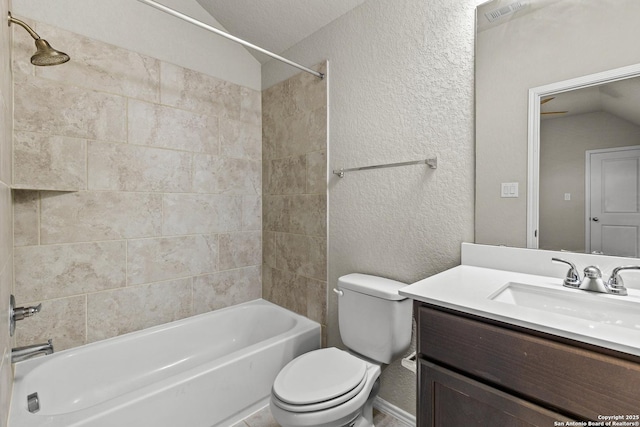 2126 Elysian, San Antonio, TX 78253 - bathroom with lofted ceiling, toilet, a textured wall, vanity, and washtub / shower combination