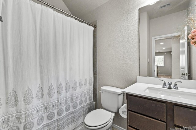 2126 Elysian, San Antonio, TX 78253 - bathroom featuring a textured wall, toilet, vanity, and a shower with curtain