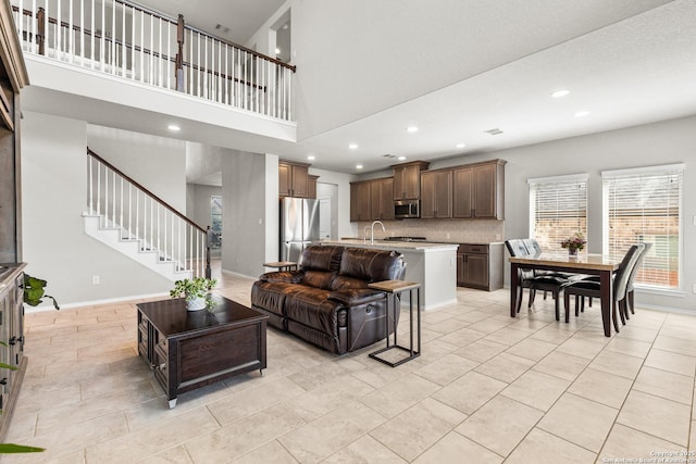 2126 Elysian, San Antonio, TX 78253 - living room featuring a towering ceiling, recessed lighting, stairs, and baseboards
