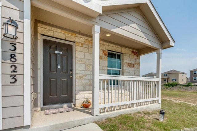 3823 Casado, Converse, TX 78109 - doorway to property with covered porch and stone siding