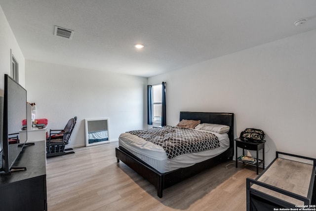 3823 Casado, Converse, TX 78109 - bedroom with light wood finished floors, a desk, and recessed lighting