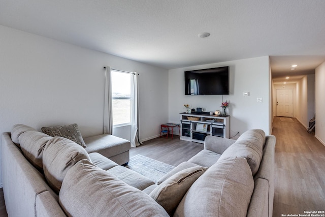 3823 Casado, Converse, TX 78109 - living area featuring light wood finished floors, baseboards, and recessed lighting