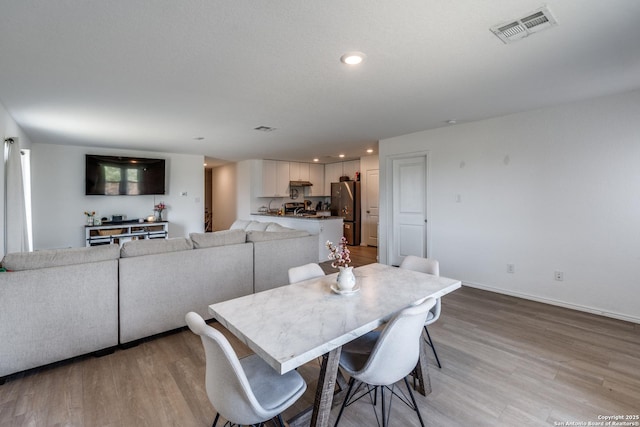 3823 Casado, Converse, TX 78109 - dining space featuring light wood finished floors, recessed lighting, and baseboards